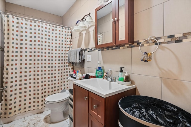 bathroom with decorative backsplash, tile walls, toilet, and vanity