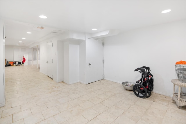 finished basement featuring recessed lighting and baseboards