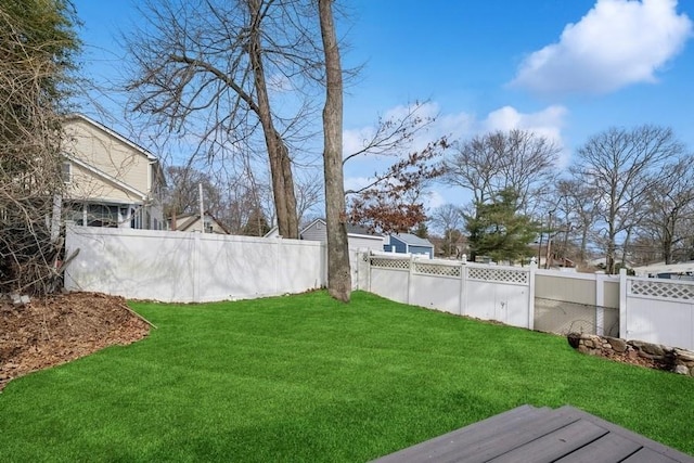 view of yard with a fenced backyard