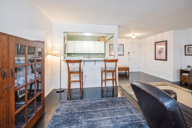 interior space with dark wood finished floors and baseboards