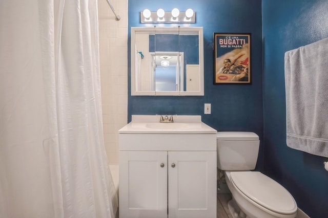 full bathroom featuring shower / bathtub combination with curtain, vanity, and toilet