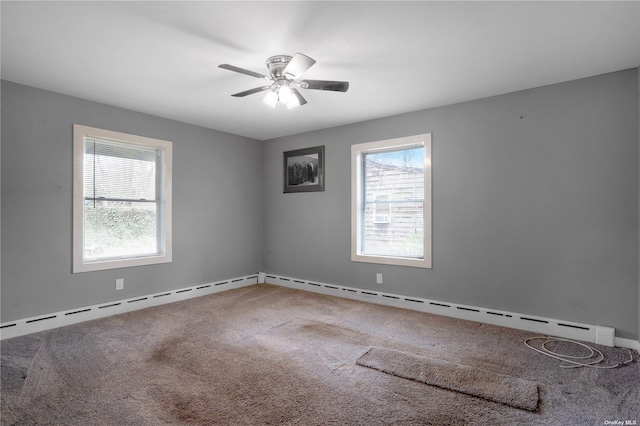 carpeted spare room featuring a ceiling fan