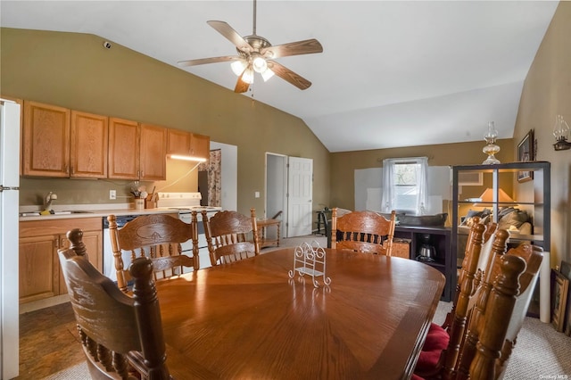 dining space with lofted ceiling and ceiling fan