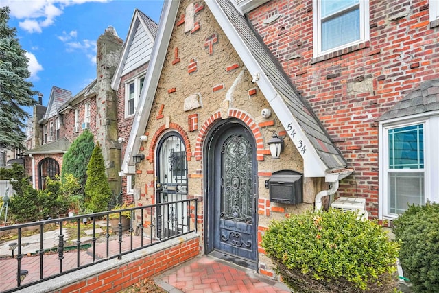 property entrance with brick siding