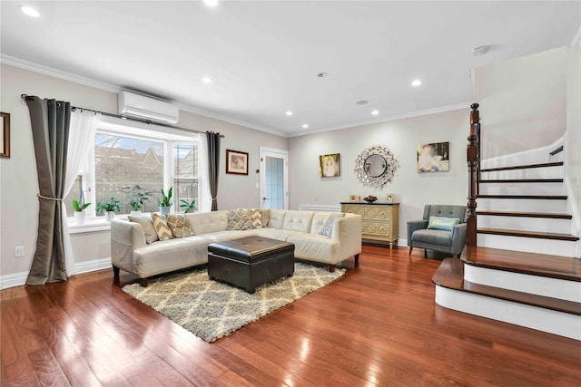 living room featuring ornamental molding, hardwood / wood-style floors, stairs, and a wall unit AC