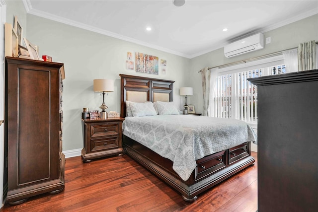 bedroom featuring baseboards, dark wood finished floors, ornamental molding, and a wall unit AC