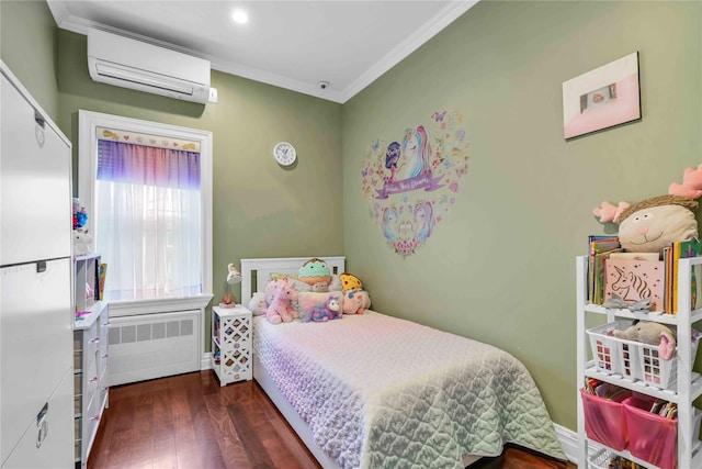 bedroom featuring an AC wall unit, wood finished floors, radiator heating unit, crown molding, and baseboards