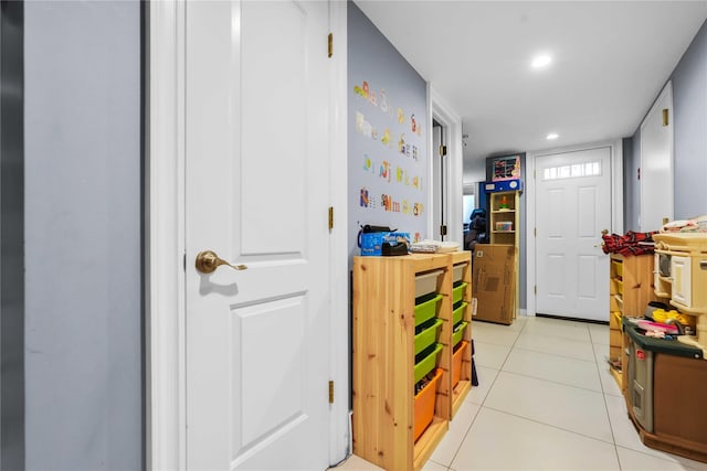 rec room with light tile patterned floors and recessed lighting