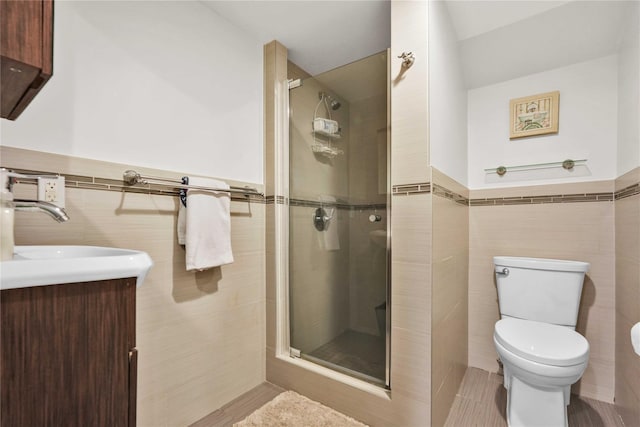 full bathroom with toilet, tile walls, and a stall shower