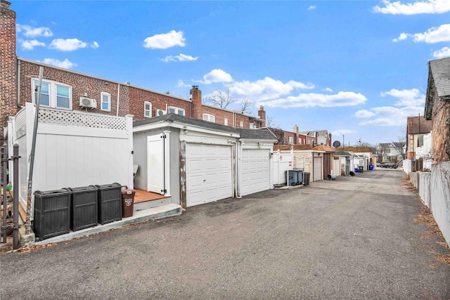 exterior space featuring community garages and a residential view