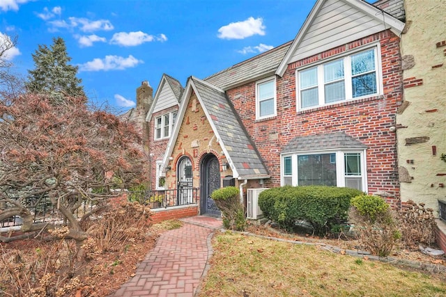 view of front of home featuring brick siding