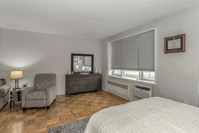 bedroom featuring a wall unit AC and radiator