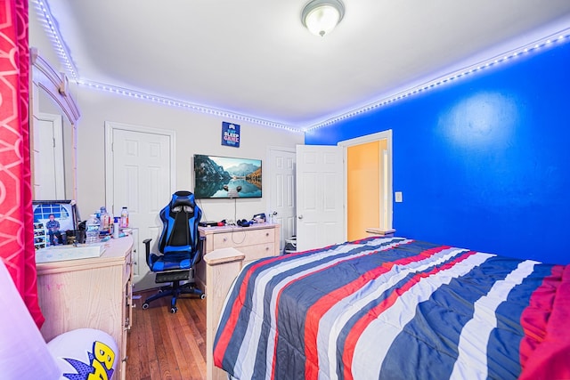 bedroom with wood finished floors