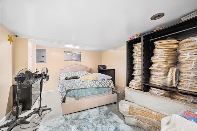 bedroom with electric panel and baseboards