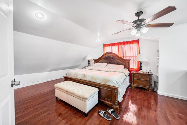 bedroom with hardwood / wood-style floors, lofted ceiling, baseboards, and ceiling fan