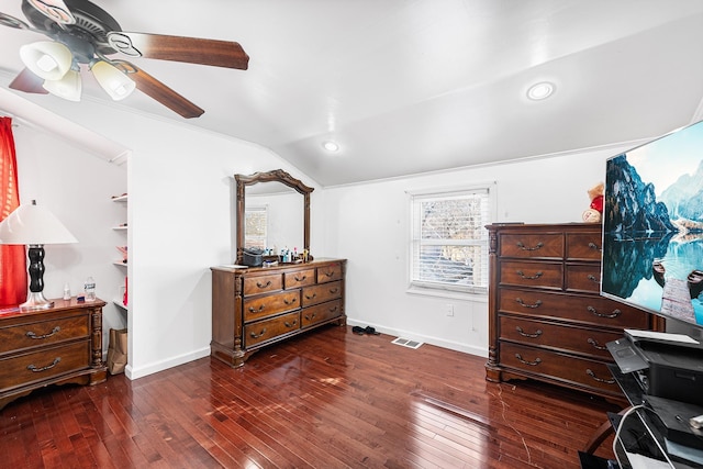 bedroom featuring visible vents, a ceiling fan, dark wood-style floors, baseboards, and vaulted ceiling