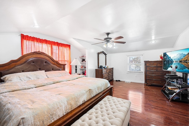 bedroom with vaulted ceiling, a ceiling fan, baseboards, and wood finished floors