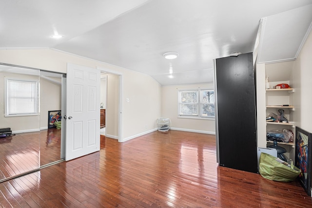 interior space with baseboards and hardwood / wood-style flooring