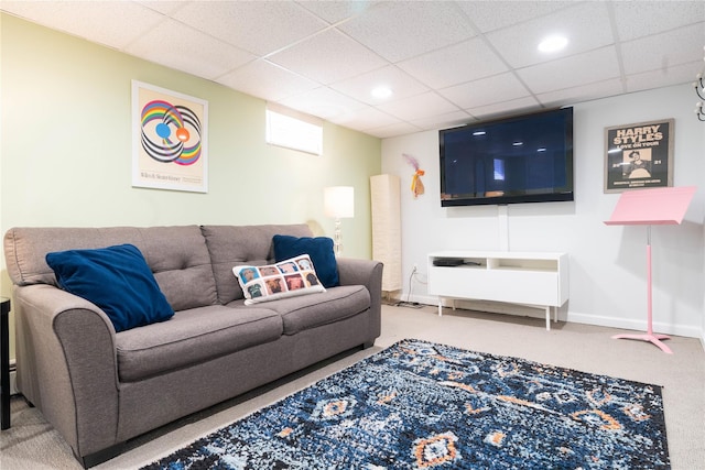 carpeted living area featuring recessed lighting, a drop ceiling, and baseboards