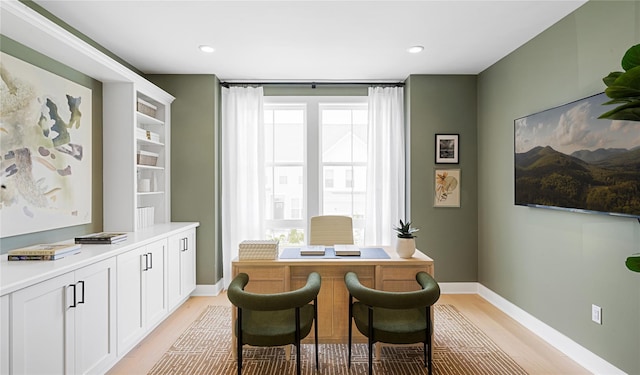 office featuring recessed lighting, light wood-style flooring, and baseboards