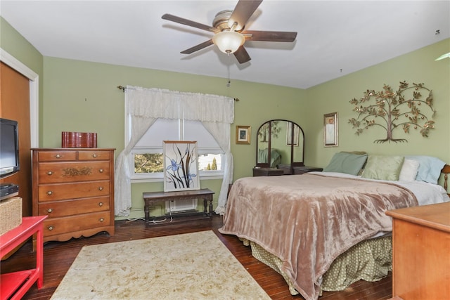 bedroom featuring dark wood finished floors and ceiling fan