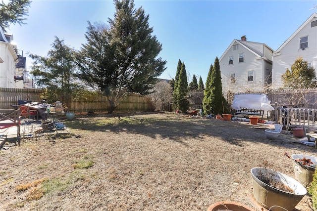 view of yard featuring a patio and a fenced backyard