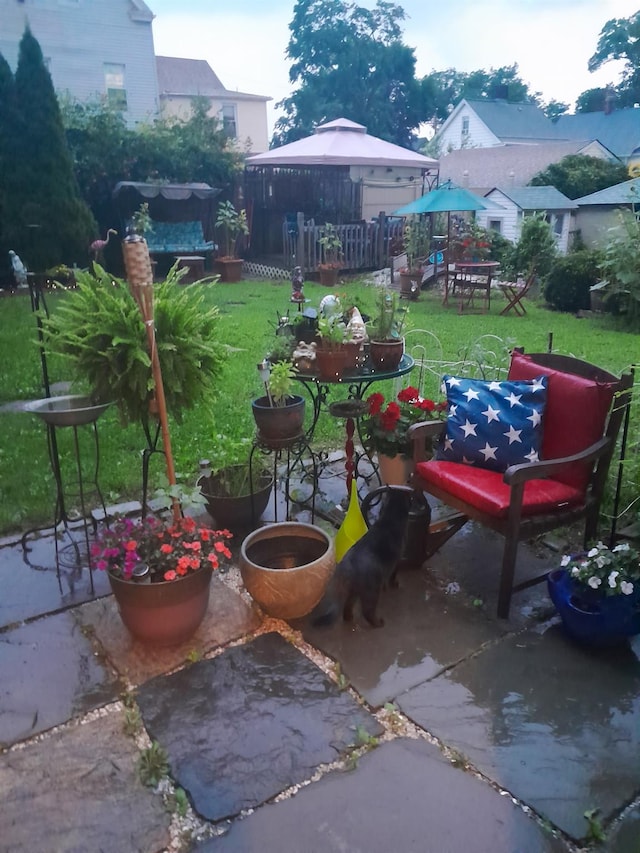 view of patio / terrace featuring fence