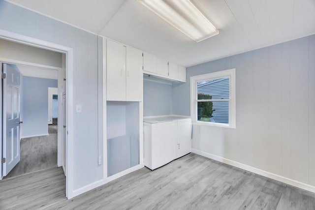 unfurnished bedroom with light wood finished floors, a closet, and baseboards