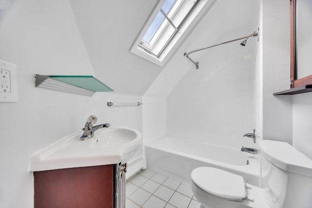 full bathroom featuring a skylight, vanity, toilet, and tile patterned floors