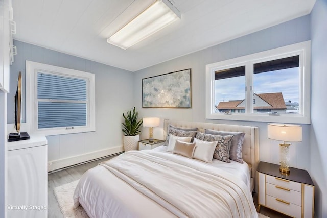 bedroom with wood finished floors