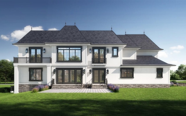 rear view of property featuring entry steps, a balcony, french doors, a lawn, and stucco siding