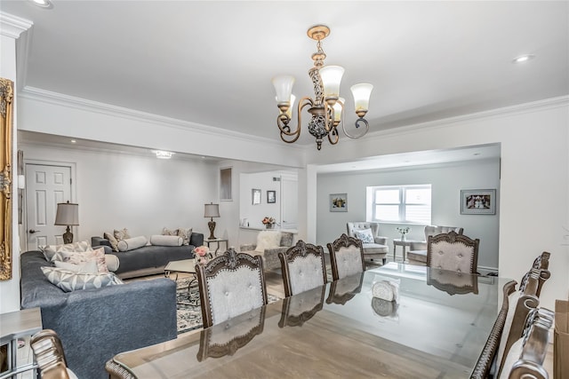 dining area with a notable chandelier, recessed lighting, wood finished floors, and crown molding