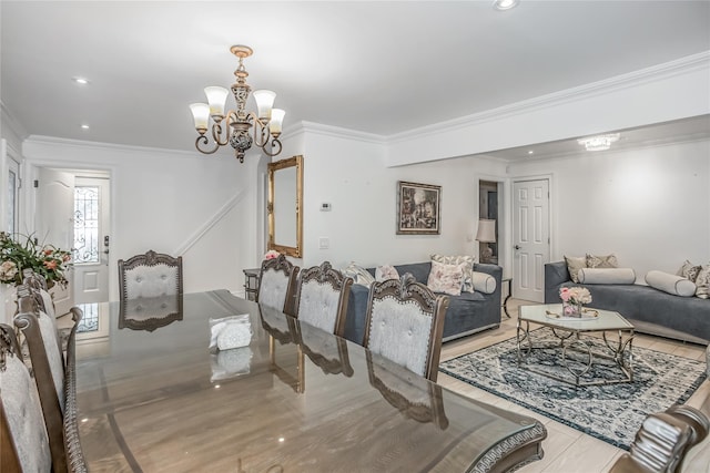 dining area with an inviting chandelier, crown molding, and recessed lighting