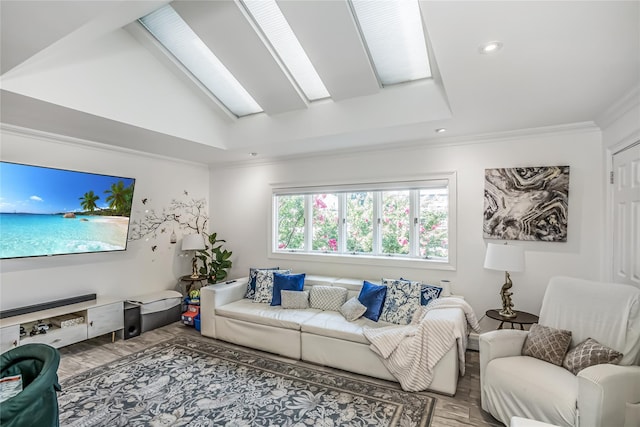 living area with vaulted ceiling with skylight, ornamental molding, wood finished floors, and recessed lighting