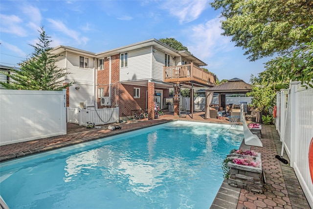 view of pool with a fenced backyard, a patio, a fenced in pool, and a gazebo