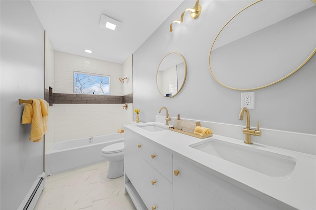 bathroom with a baseboard heating unit, toilet, marble finish floor, and a sink