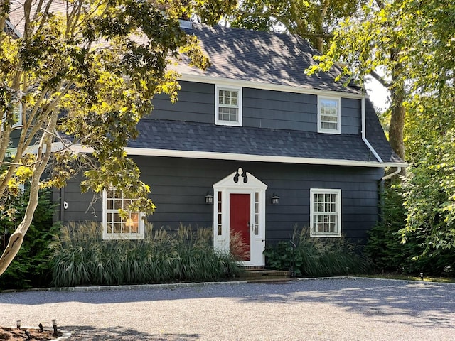 view of front facade with a shingled roof