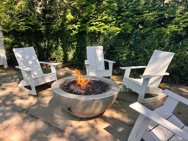 27 Notamiset Rd, Westhampton Beach, NY 11978 - view of patio / terrace with a fire pit