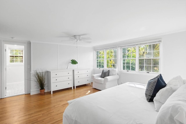 27 Notamiset Rd, Westhampton Beach, NY 11978 - bedroom with a ceiling fan, multiple windows, ornamental molding, and wood finished floors