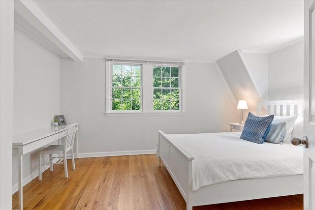 27 Notamiset Rd, Westhampton Beach, NY 11978 - bedroom featuring crown molding, light wood-type flooring, and baseboards