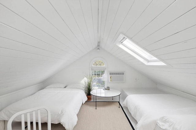 27 Notamiset Rd, Westhampton Beach, NY 11978 - bedroom featuring lofted ceiling with skylight and a wall mounted air conditioner