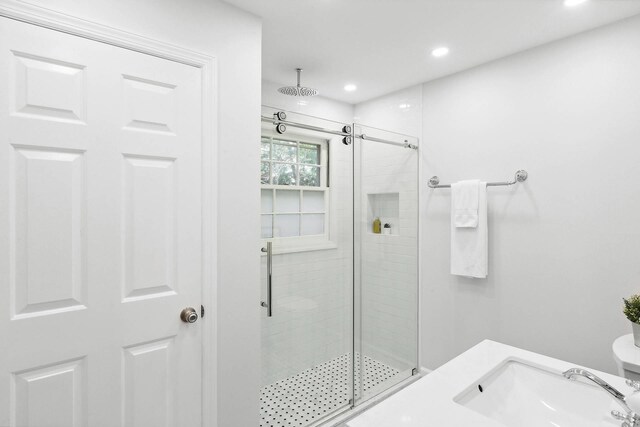 27 Notamiset Rd, Westhampton Beach, NY 11978 - full bathroom featuring a shower stall, a sink, and recessed lighting