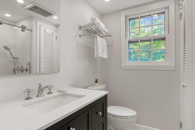 27 Notamiset Rd, Westhampton Beach, NY 11978 - full bath featuring recessed lighting, visible vents, toilet, a tile shower, and vanity