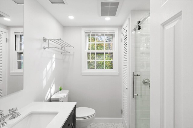 27 Notamiset Rd, Westhampton Beach, NY 11978 - full bathroom featuring visible vents, toilet, a shower stall, vanity, and baseboards
