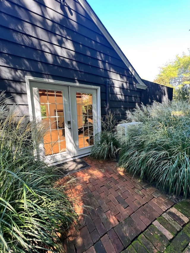 27 Notamiset Rd, Westhampton Beach, NY 11978 - exterior space featuring french doors and a patio