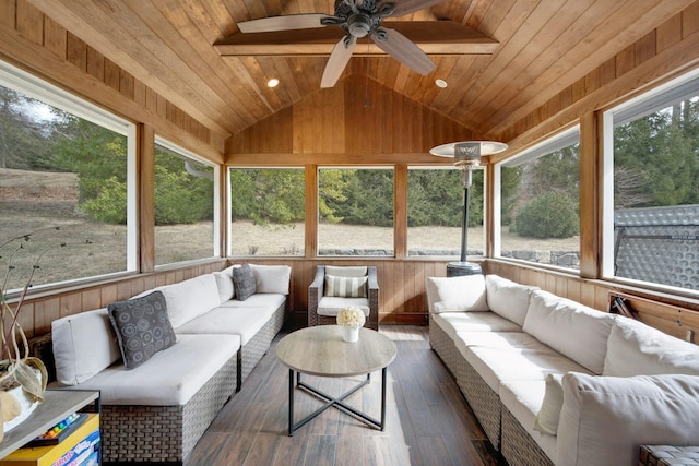 sunroom / solarium with a ceiling fan, a wealth of natural light, wooden ceiling, and vaulted ceiling