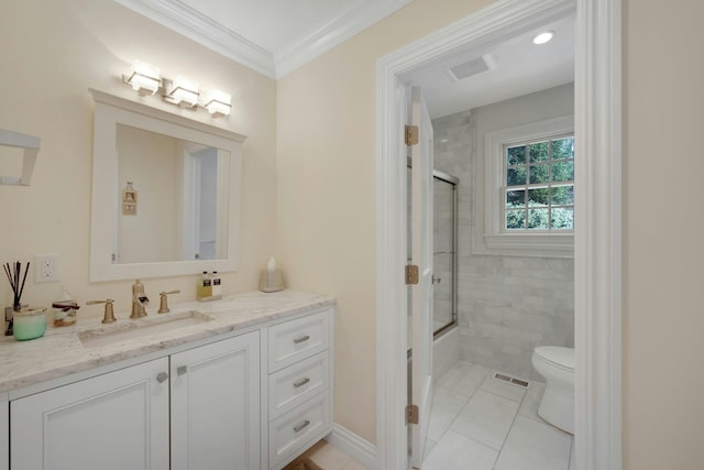 bathroom featuring shower / bath combination with glass door, crown molding, visible vents, toilet, and vanity