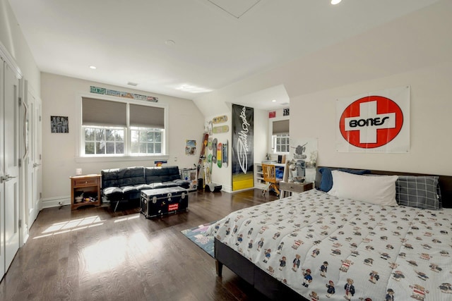 bedroom featuring baseboards, wood finished floors, and recessed lighting