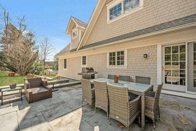 view of patio featuring outdoor dining space and grilling area