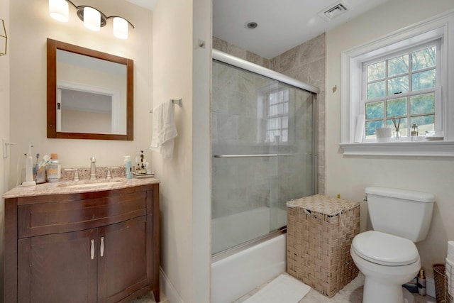 full bath with toilet, vanity, visible vents, and enclosed tub / shower combo